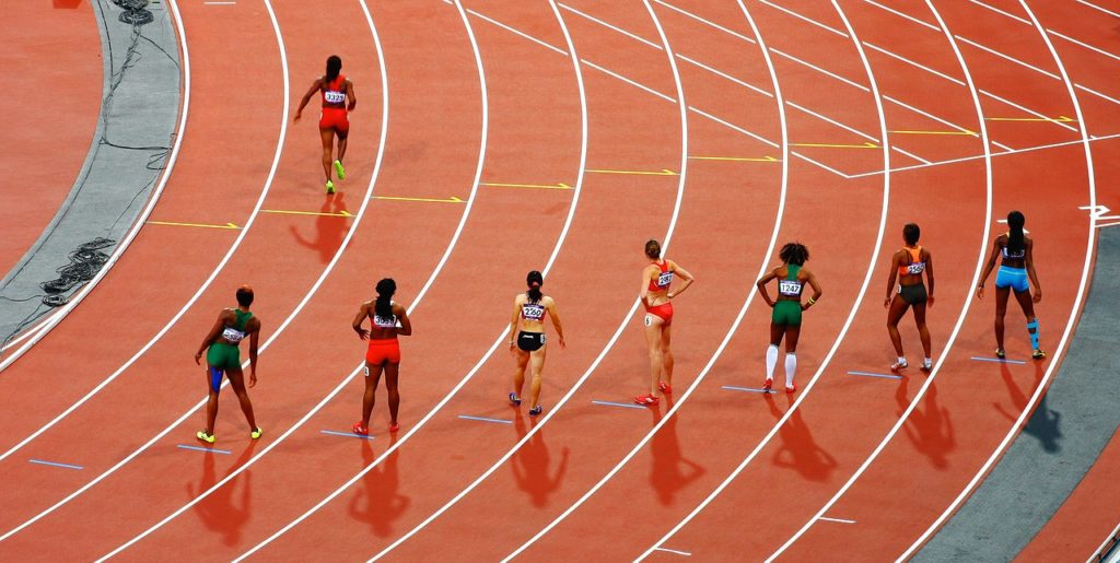 photo of runners waiting to race down their lanes