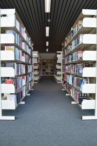 photo looking down a library aisle